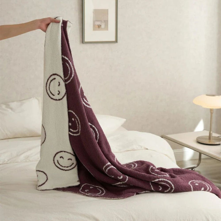 Gestrickte Decke mit Smiley-Muster
