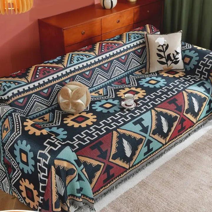 Sofaüberwurf mit Aztekenmuster und Quasten