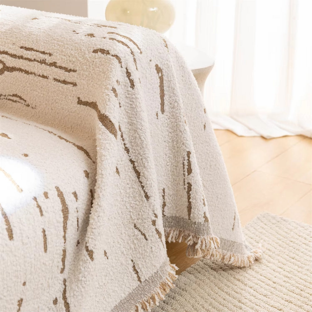 Geometrische Jacquard-Sofadecke mit Quasten