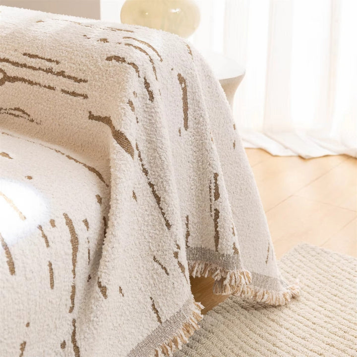 Geometrische Jacquard-Sofadecke mit Quasten