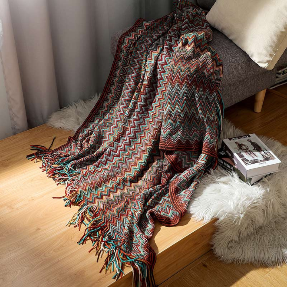Farbige Zickzack-Strickdecke mit Quasten