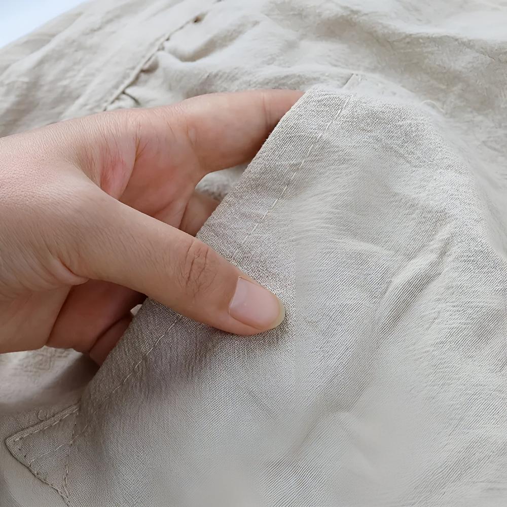 Schürze aus Baumwollmischgewebe mit Rüschen und Tasche