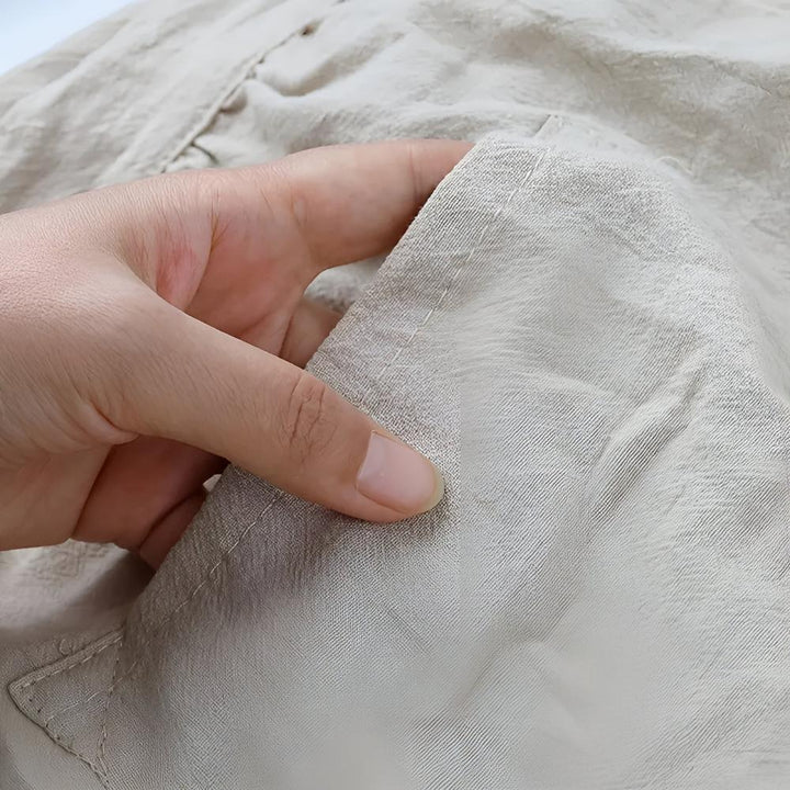 Schürze aus Baumwollmischgewebe mit Rüschen und Tasche