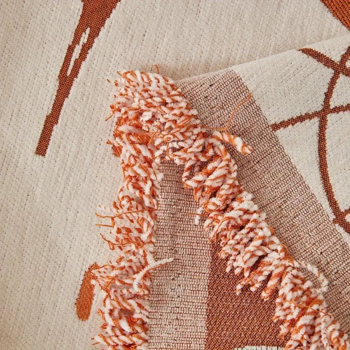 Wendbare Chenille-Sofadecke mit Blumenmuster und Quasten