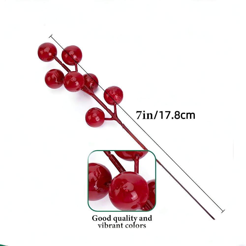 Künstliche Tannenzweige mit roten Beeren