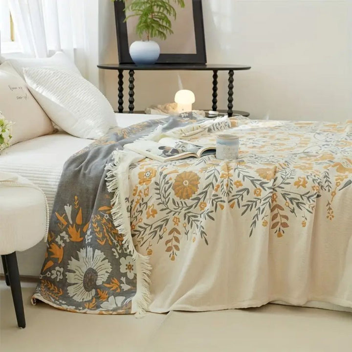 Wendbare Baumwolldecke mit ornamentalem Blumenmuster