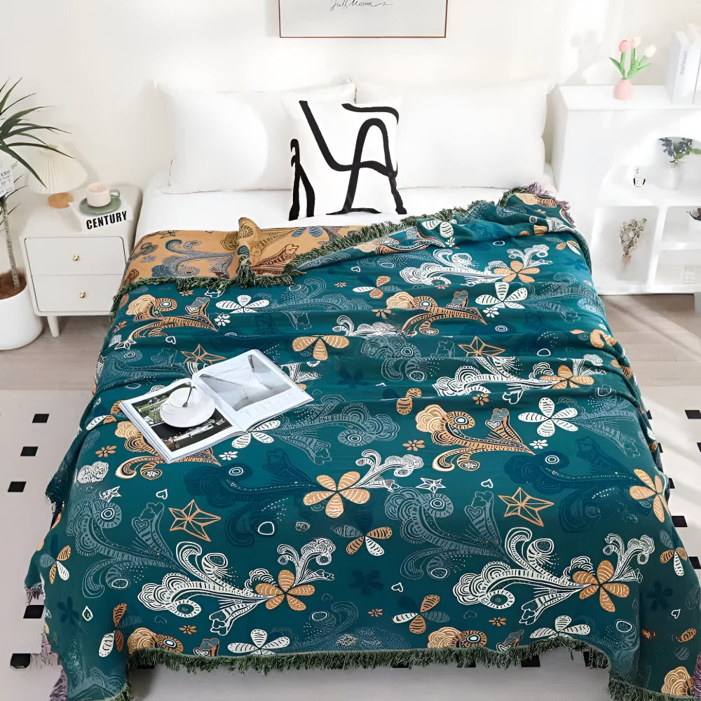 Baumwollplaid mit exotischen Blumen und Fransen