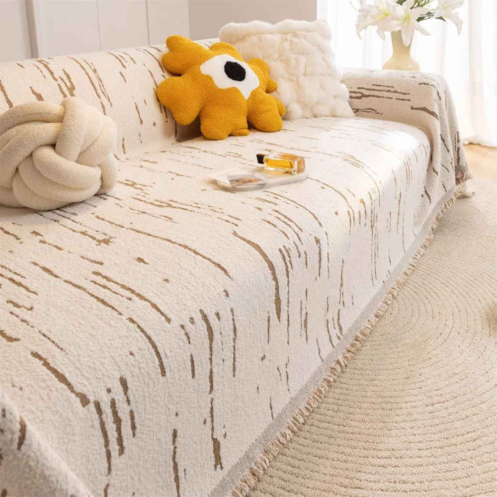 Geometrische Jacquard-Sofadecke mit Quasten