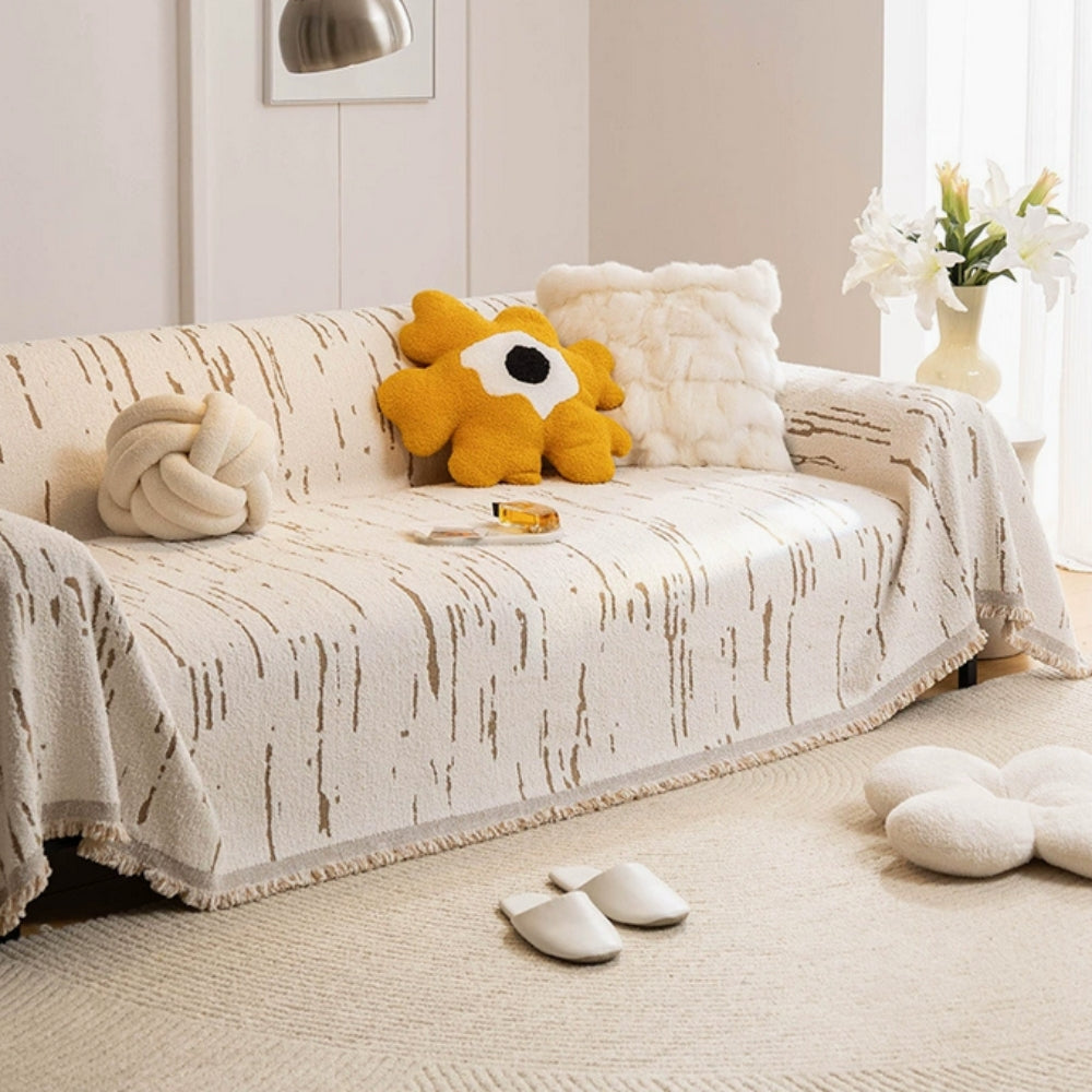Geometrische Jacquard-Sofadecke mit Quasten