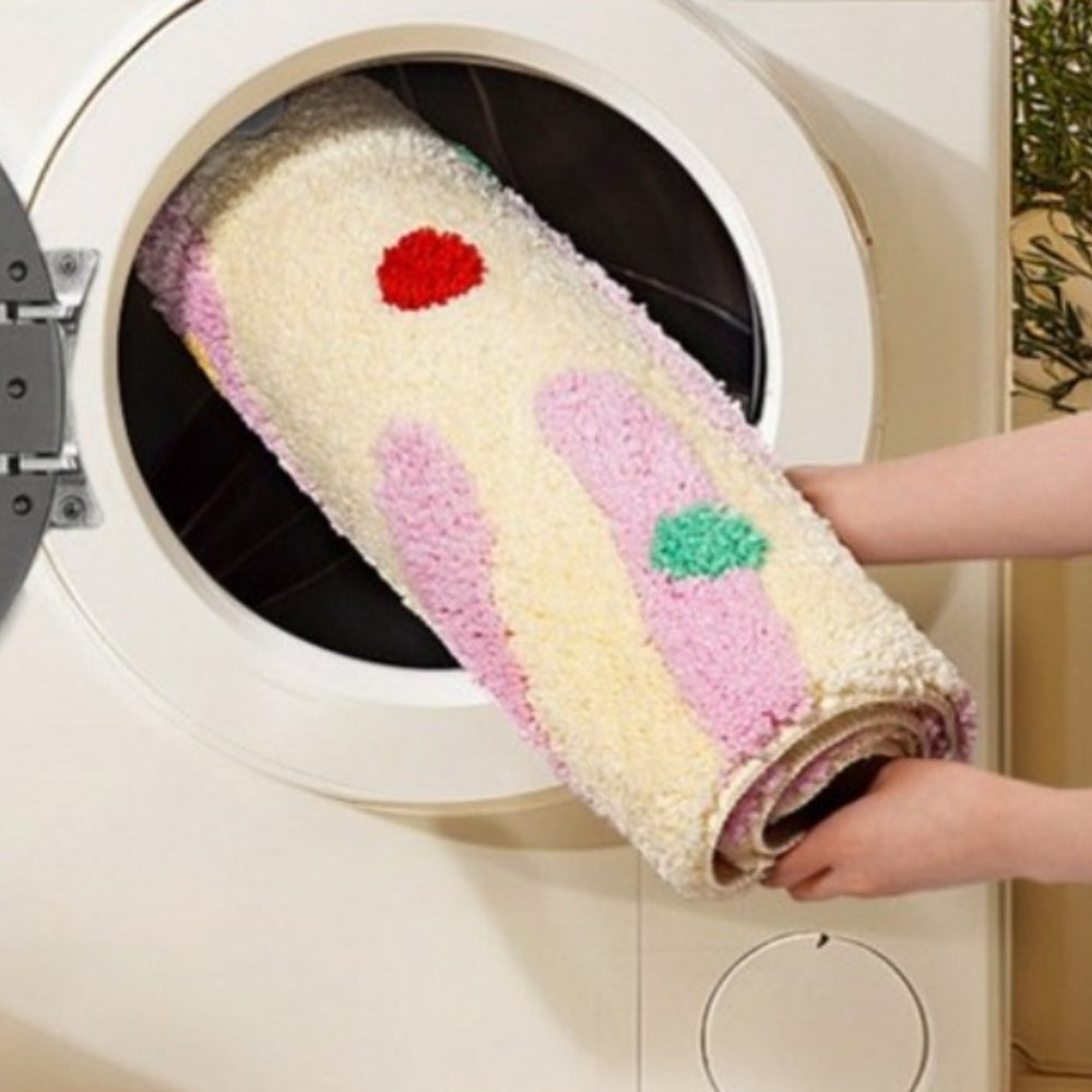 Badematte mit Wellen und bunten Punkten