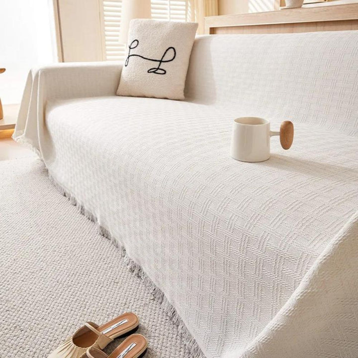 Geometrische gesteppte Sofadecke mit Quasten