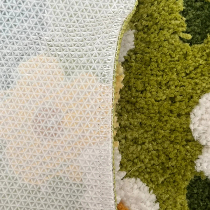 Badematte in Moosoptik mit Gänseblümchen