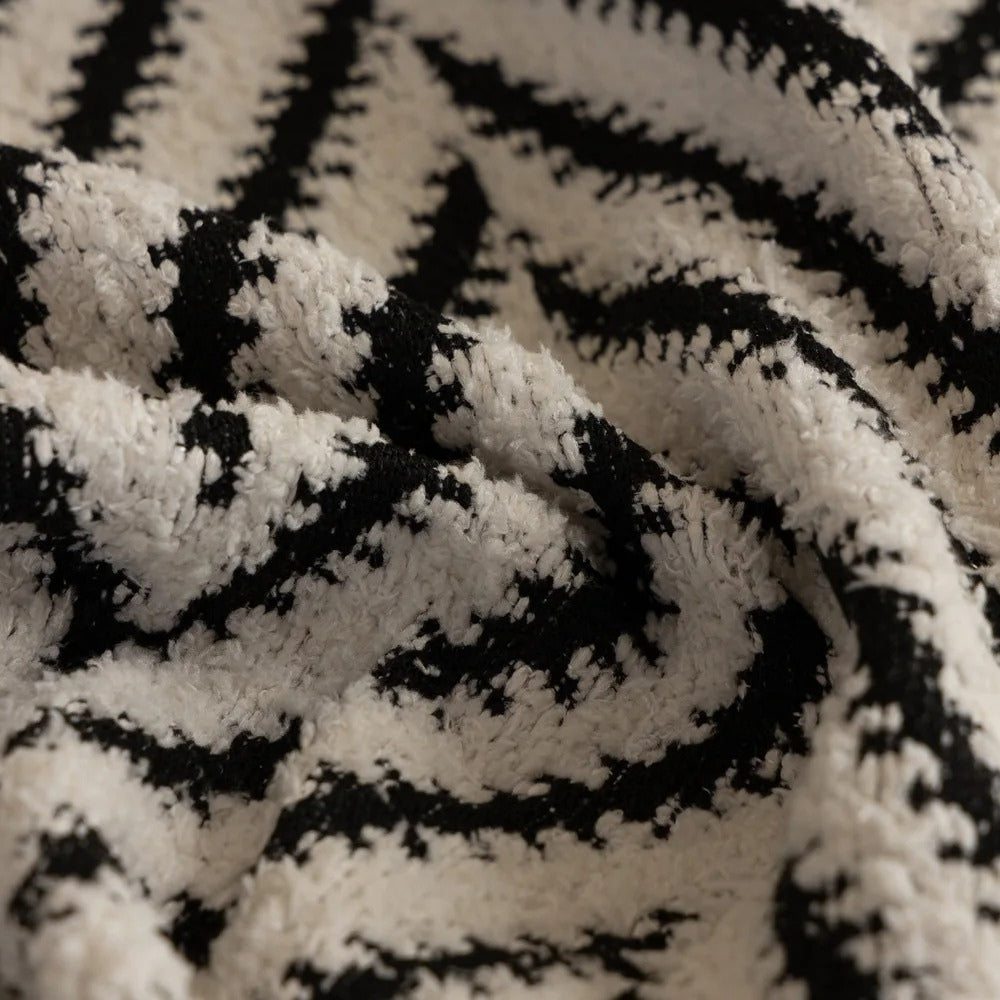 Boho-Stricksofadecke mit Quasten