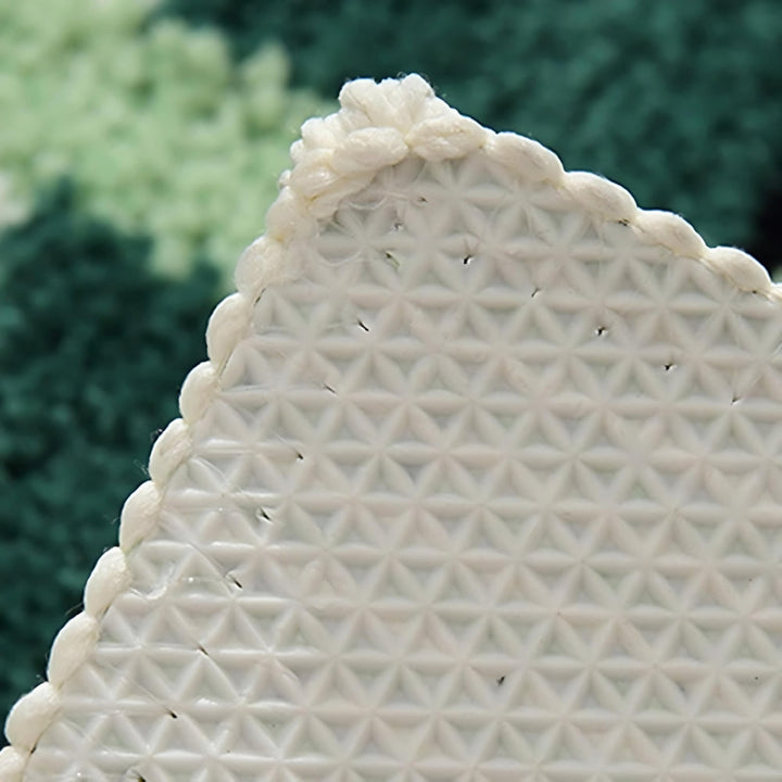 Geometrische Badematte in Moosgrün