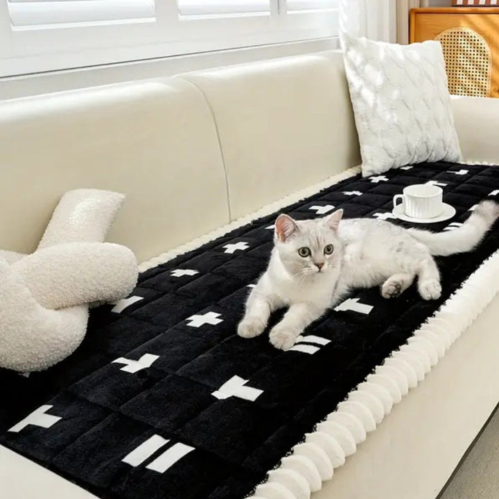 Gesteppter Sofaüberwurf mit Rüschenkante