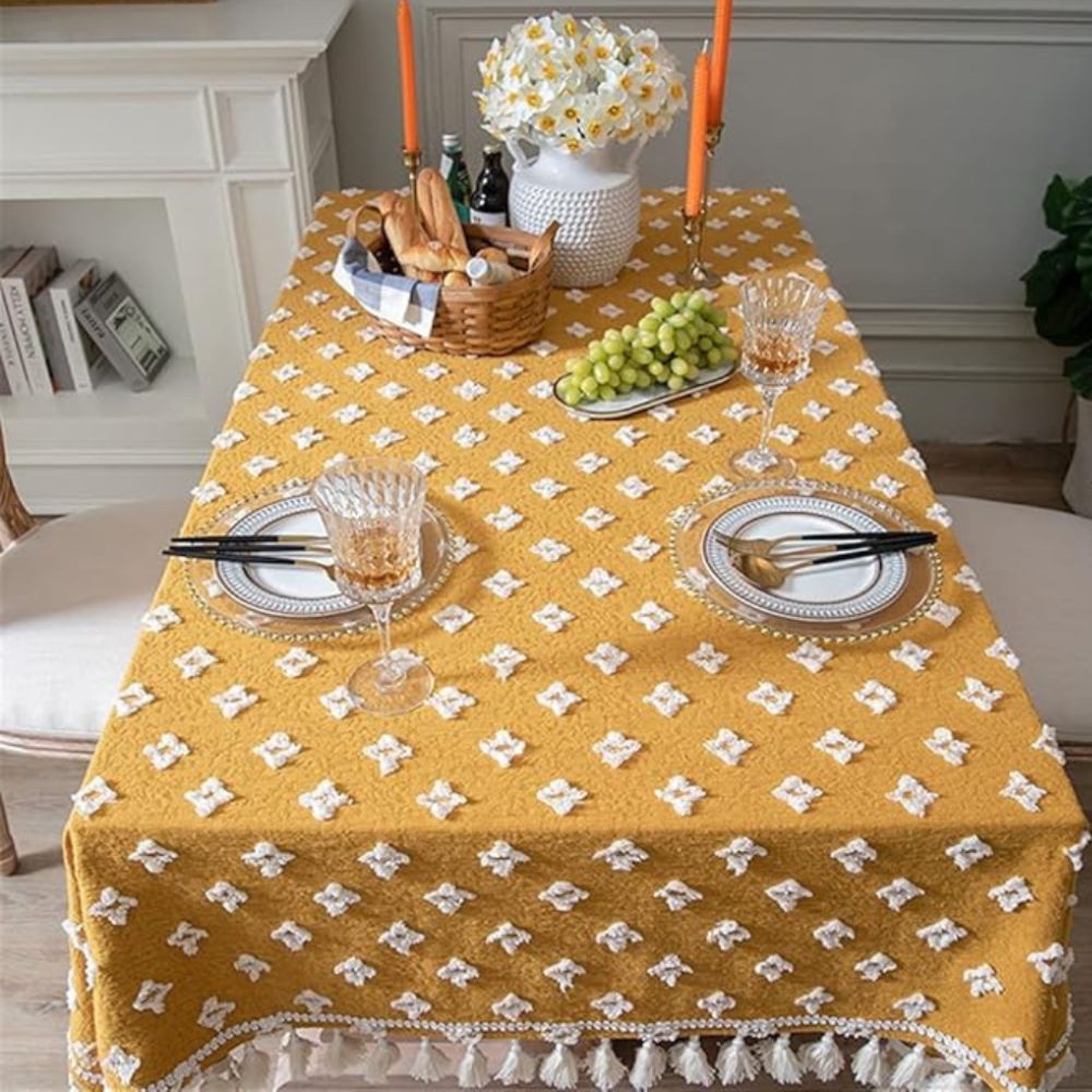 Gelbe bestickte Tischdecke mit Quasten