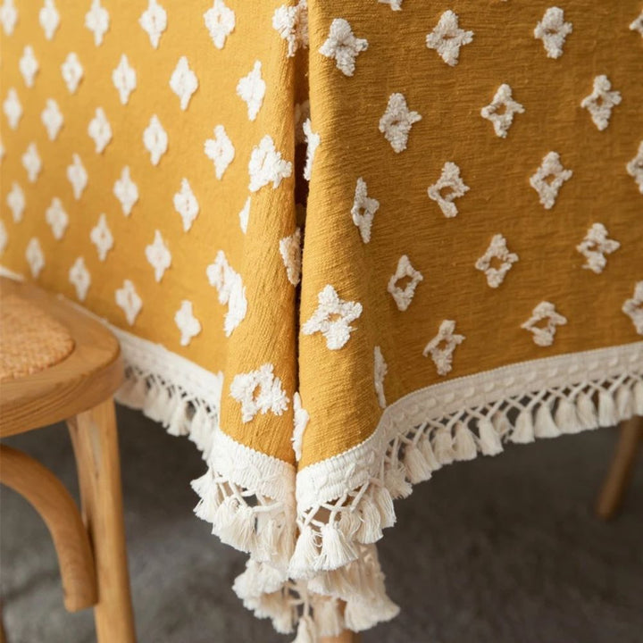 Gelbe bestickte Tischdecke mit Quasten