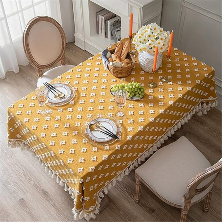 Gelbe bestickte Tischdecke mit Quasten