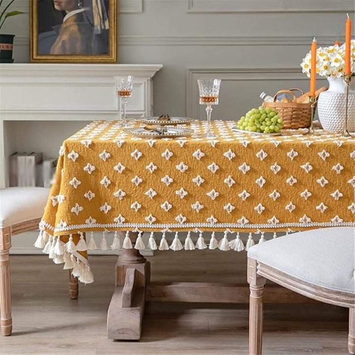 Gelbe bestickte Tischdecke mit Quasten